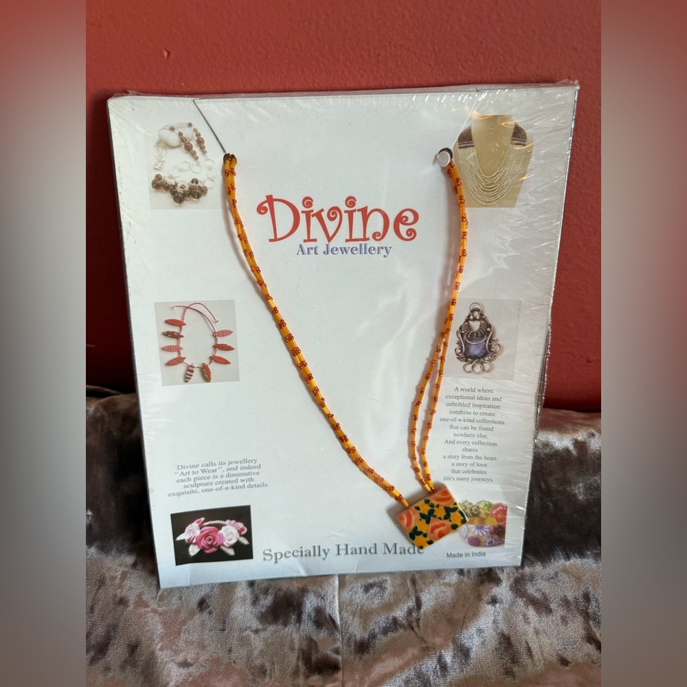 Beaded Orange Necklace
DIVINE : Anthropology